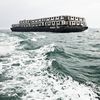 Surreal Photos Show NYC Subway Cars Being Dumped Into The Ocean